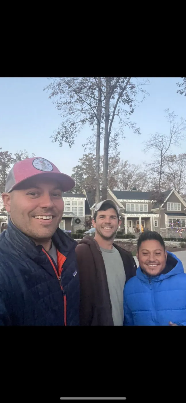 Members of the Raleigh Gutter Cleaning LLC team outdoors